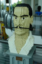 1904 - 1989.  It's fitting for a surrealist artist to be enthroned in Lego Land.<code><br /></code>Lego Creation Center, Lego Land